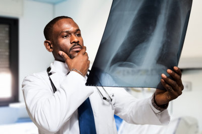 portrait of a doctor looking at a radiography